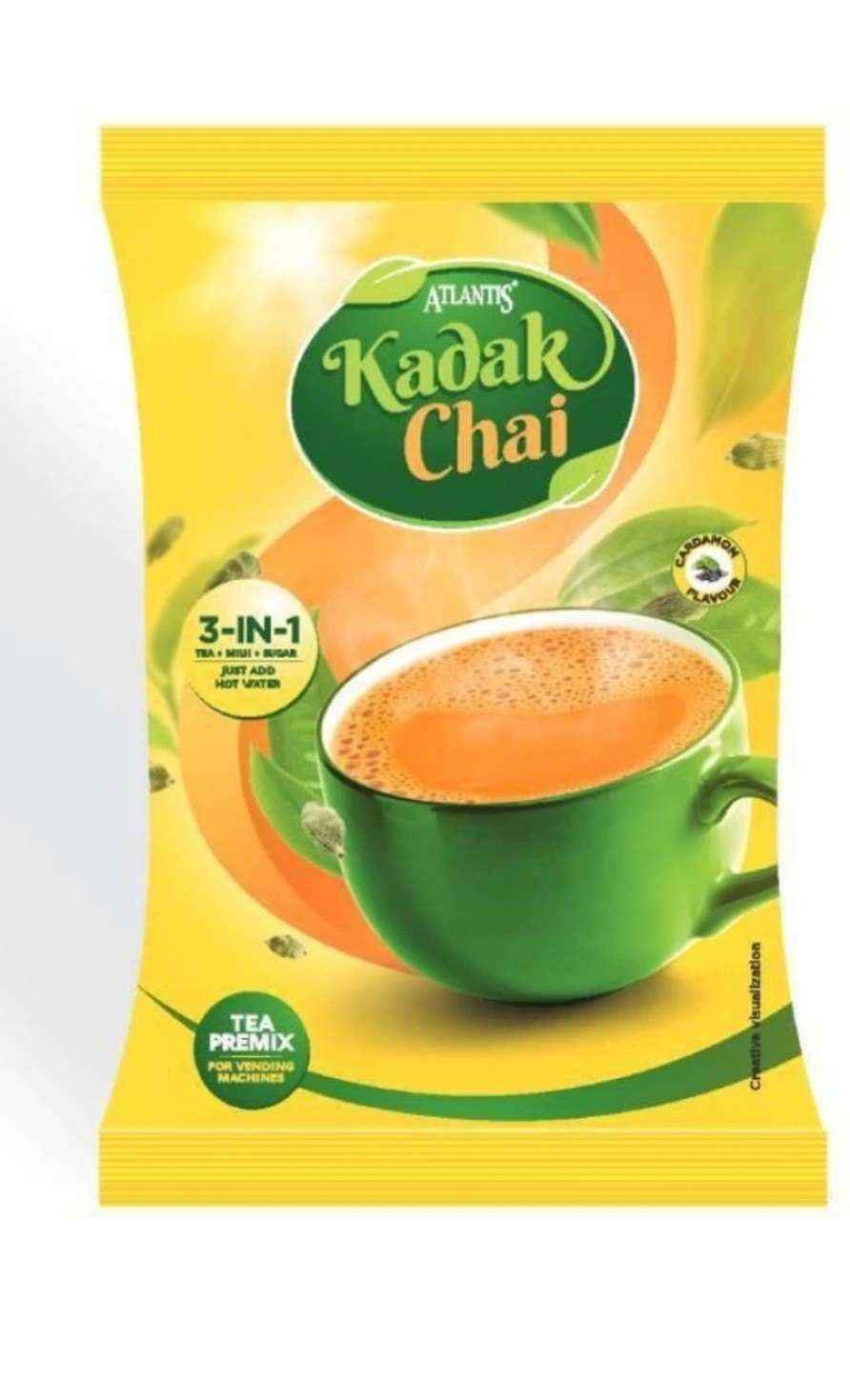 Atlantis kadak tea 1kg packet with green cup filled with frothy tea and 3-in-1 tea premix