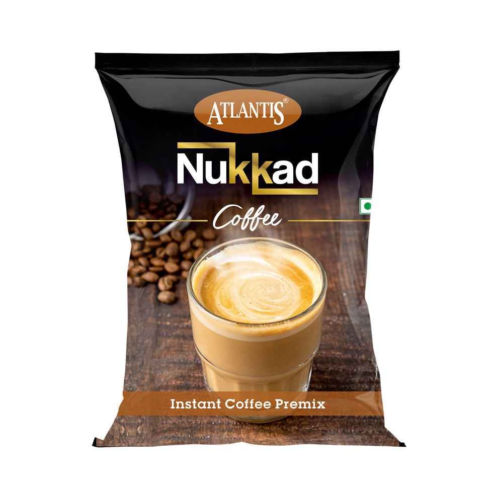 Atlantis Nukkad instant coffee premix 1kg pack with a glass of creamy coffee and coffee beans