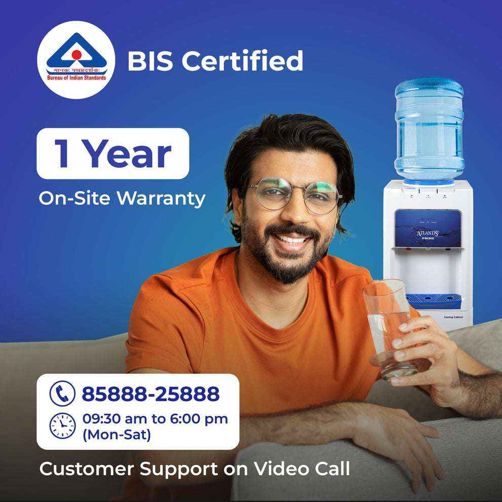 Smiling man with glass of water using Atlantis Prime water dispenser Cooling Cabinet 3 Taps with BIS certification
