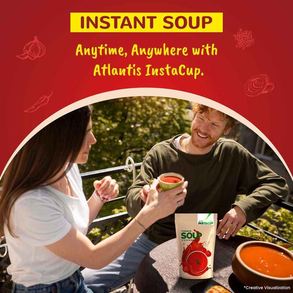 Two people enjoying a cup of Atlantis tomato soup powder for vending machines outdoors