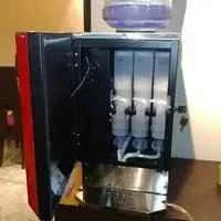 Automatic tea and coffee vending machine with transparent compartments and black and red finish