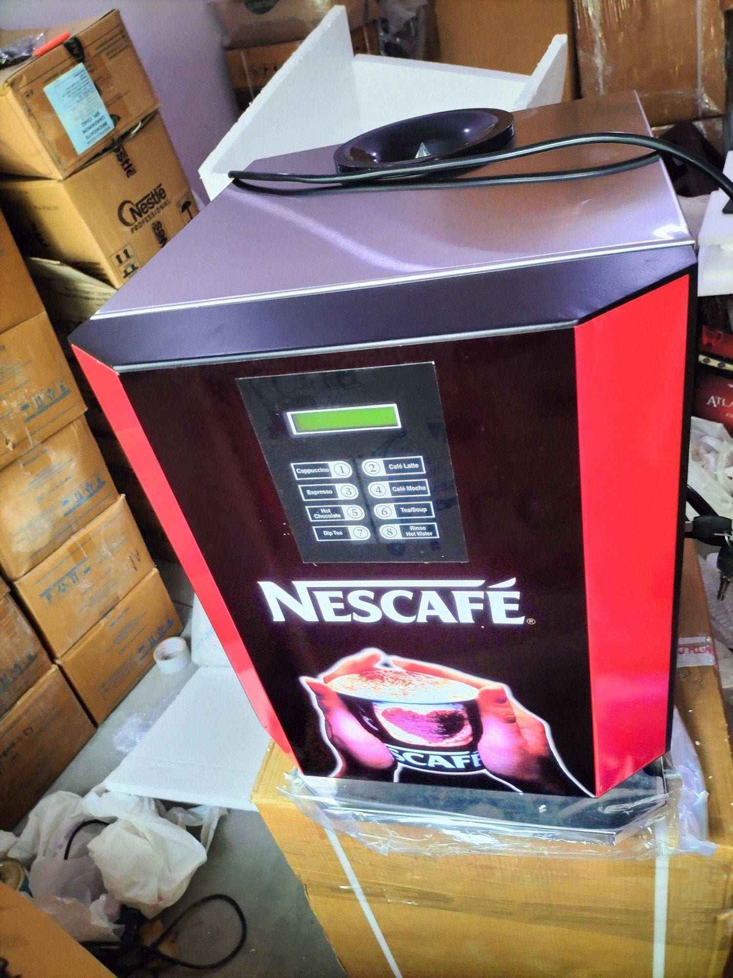 Nescafé branded multi option hot beverage dispenser with digital display and selection buttons