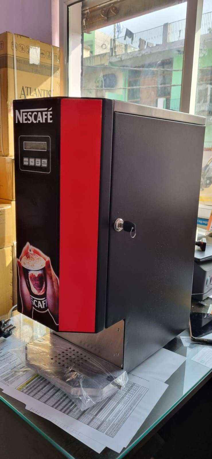 Nescafe 2 lane coffee machine in black and red with digital display for tea coffee vending service